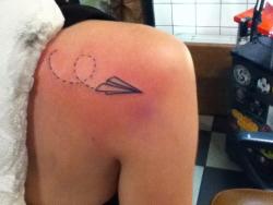 fuckyeahtattoos:  I chose to get a paper airplane tattoo because I am an exchange student currently living in Germany and I am friends with people from just about every country in the world because of this. To me it represents all of my past and future
