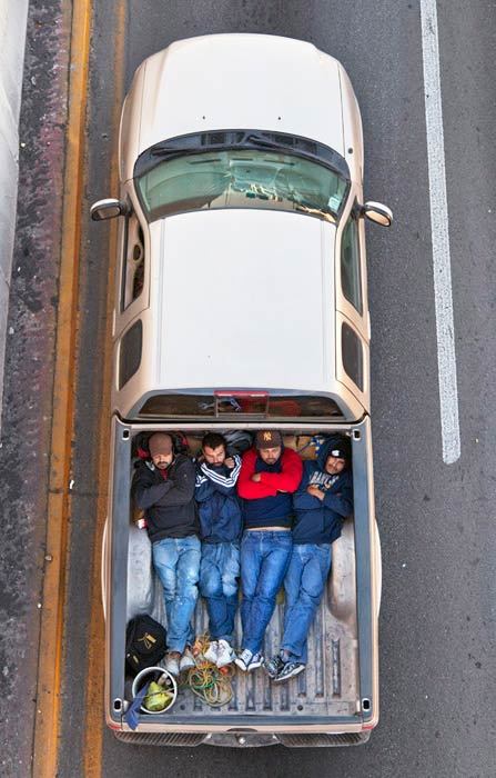 bearpope:  Alejandro Cartagena captured Mexican workers on their way to job sites in Car Poolers. This is such an amazing and simple photo series.  