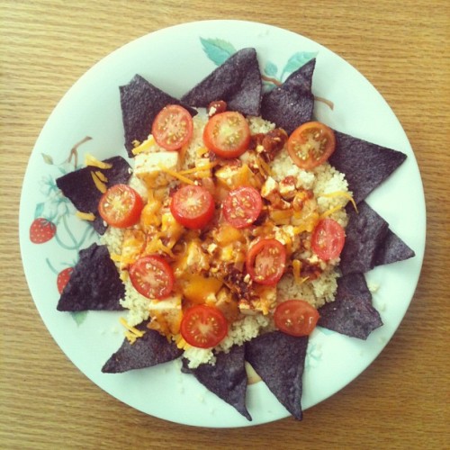 Pan-seared tofu that I marinated in a Mexican style tomato sauce with sautéed onions. All on a bed o