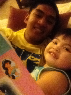 Reading my baby sister a Disney Princess