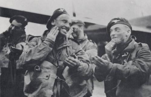 British Paratroopers applying camouflage cream.