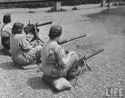 Women firing machine guns at Aberdeen Proving