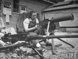 Women firing machine guns at Aberdeen Proving