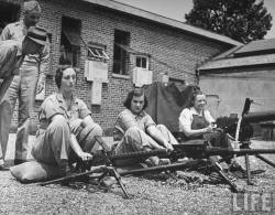 Women firing machine guns at Aberdeen Proving