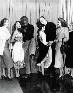 vintagegal:     Glenn Strange and Lon Chaney, Jr. find a couple of girls to dance with during the production of “Abbott and Costello Meet Frankenstein&quot; (1948) 