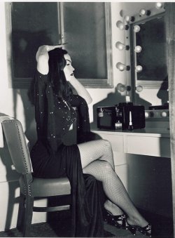 wonderlandla:  &ldquo;While attending classes at the Girls Undertaking Teacher’s School, Vampira was voted Miss Suffermore of 1913. According to the college records, her best subject was decomposition.&rdquo; -1954 tabloid Vampira at make up table /