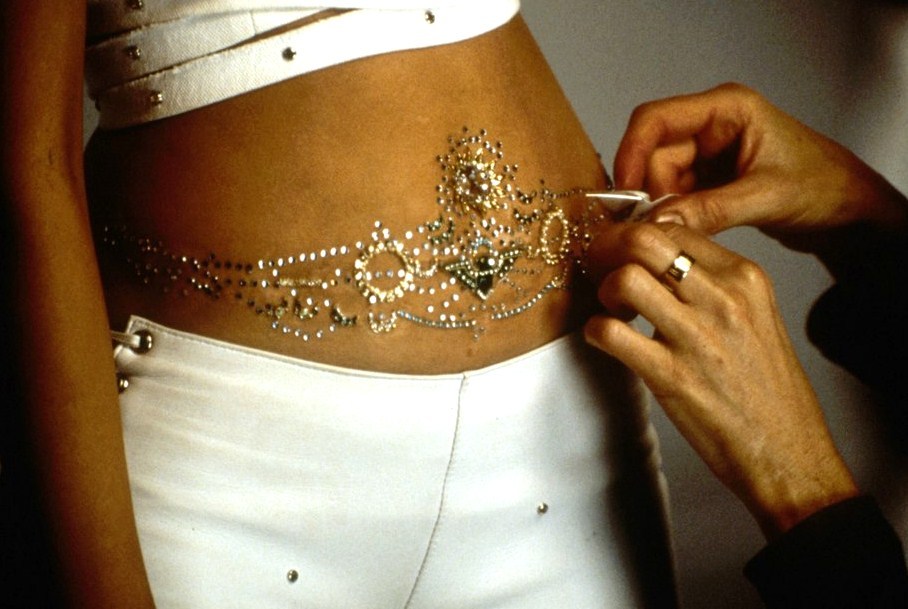 zigazig-ah:  Gems being applied to Christina Aguilera’s stomach for the “Come