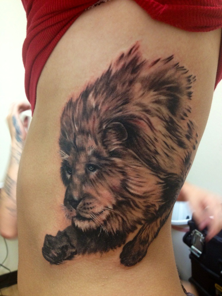 First tattoo, and couldn’t be happier with the results! Taken Right after. This lion is located on my ribs on the left side, by my heart. This tattoos concept was originally a lion to represent my papa-who has a lion heart. My papa is one of the most...