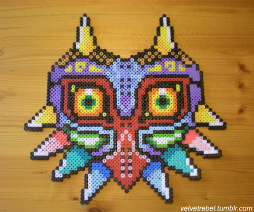 velvetrebel:  Masks from Majora’s Mask created using perler beads. Patterns/pixel art for Deku, Goron, and Zora Masks created by me. 