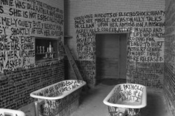   Graffiti in an abandoned mental institution.  this is haunting 