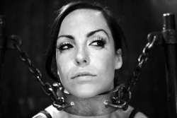 brutalmaster:  thegirlpashn:  Chained!  She’s now ready for repeated oral usage by the gang of men waiting just outside. 