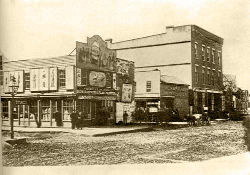 The south west corner of Madison and Dearborn, 1853, Chicago. There is an alley in the center of the photo which was known as Newspaper Alley…the first Tribune building would be erected here in 1869.