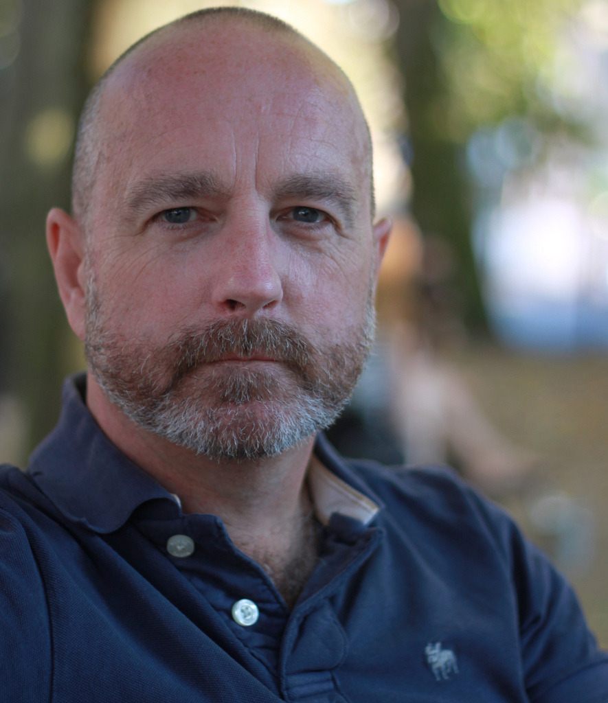 hairyfaces:  Handsome dad, and look at the treat peering from the open shirt. 