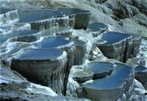     Pamukkale, Turkey, is home to hot springs that flow downhill and leave mineral deposits that bui