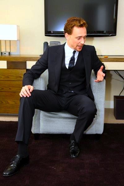 ***
He is packing a massive weapon–he has no choice but to sit this way. The monster in his pants has to have some room to move. Hiddles is tall, long legs, with lengthy shoes. He’s perfection.