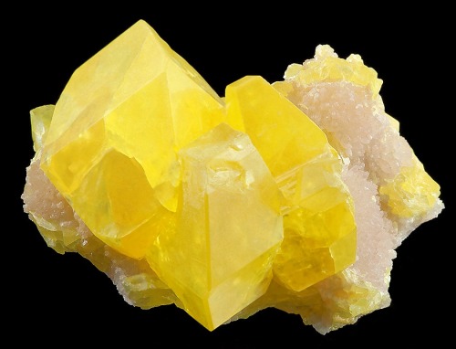 billycrystalbillycrystal:  Large crystals of Sulfur set atop Aragonite covered matrix 