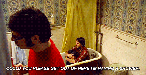 Bret McKenzie of Flight of the Conchords. 
In a bathtub having a shower.