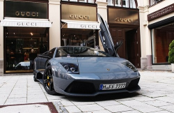 iloveluxurythings:  Ferrari parked in front of the Gucci store. 