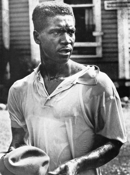 updownsmilefrown:  A Birmingham Civil Rights activist glares at the firemen who have just assaulted him with a water hose, 1963 by Charles Moore 