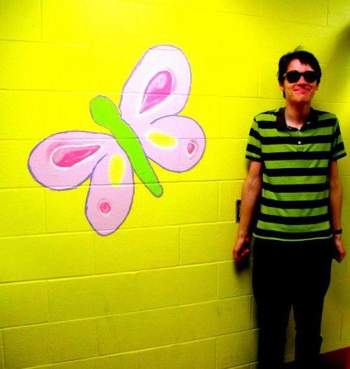 Cameron with butterfly mural 2010 Photographed by Annie Lynch