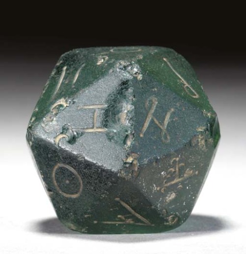 thesem:Oh wow it’s a d20 from 2nd Century RomeBest part? The lot notes:Several polyhedra in various 