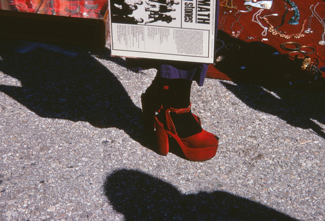  Aftermath A woman in red heels holds a copy of Aftermath by the Rolling Stones at a