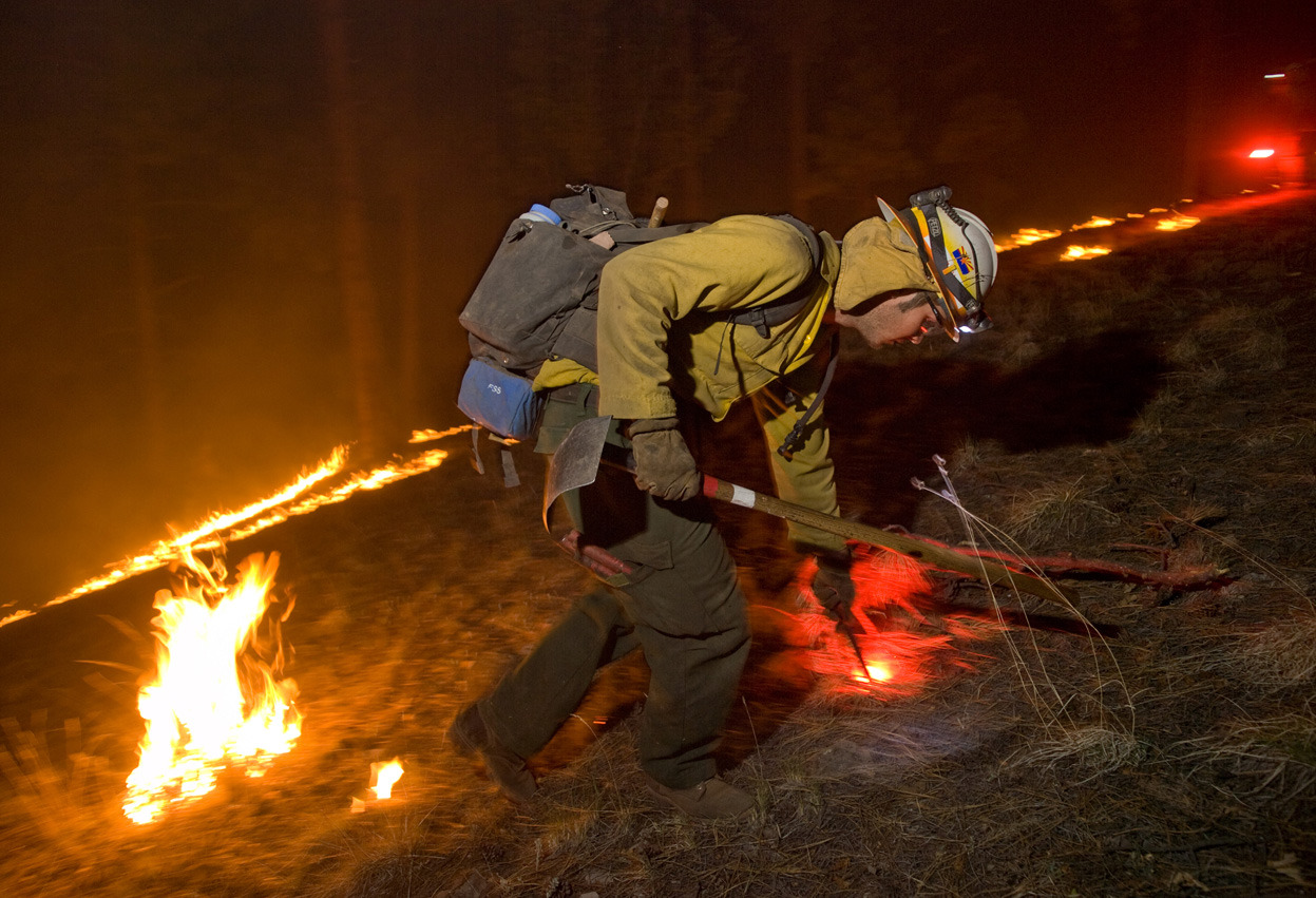 From Western Wildfires, one of 35 photos. A firefighter ignites a controlled burn, battling the Whitewater-Baldy Complex fire, in Gila National Forest, New Mexico, in May of 2012. (Kari Greer/USFS)