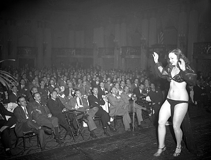 In a vintage photo dated from 1946, Betty Rowland performs her striptease act at