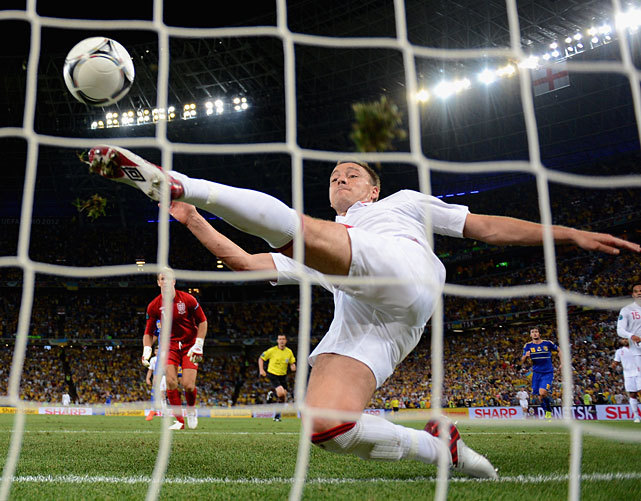 siphotos:  In one of the most controversial plays of Euro 2012, John Terry just clears
