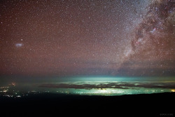 wavesoftware:  Beauty Exists Above the Lights  From high altitude slopes of Mount Kilimanjaro, the highest mountain in Africa, a starry night is photographed over the lights of Moshi, a town situated on the lower southern slopes of Kilimanjaro.