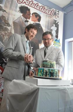midtowncomics:  Scott &amp; Jason’s Wedding at Midtown Comics (photos by Ron ‘Spidey’ Gejon) Yesterday, Midtown Comics was proud to host the wedding of Scott Everhart and Jason Walker, two self-professed “geeks in love”  inspired by the proposal