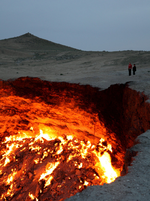 vvolare:  Formed in 1971 when a team of soveit geologists had their drilling rig collapse when they hit a cavern filled with natural gas, Derweze is a 70 meter wide hole in Turkmenistan. In an attempt to avoid poisonous discharge, they decided to burn