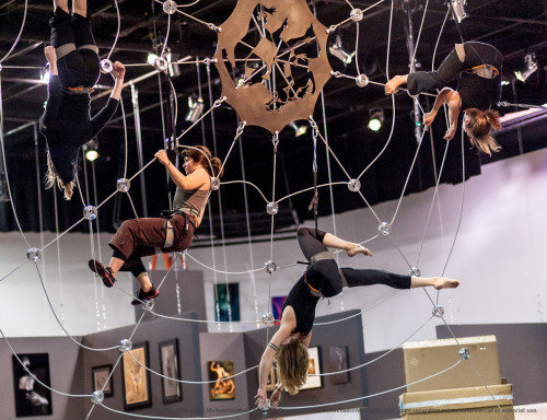 Aerialists practicing on their custom-built spiderweb prior to the opening of the 2012 Seattle Eroti