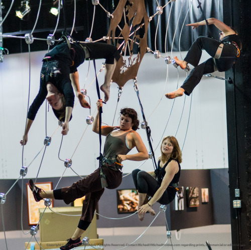 Aerialists practicing on their custom-built spiderweb prior to the opening of the 2012 Seattle Eroti