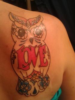 fuckyeahtattoos:  I always wanted to get an owl tattoo, because it’s my favorite animal. Once I had the money, I decided to buy myself a graduation present and get my very first tattoo. This tattoo was done at Eye Candy Tattoo in Omaha, NE by Anthony