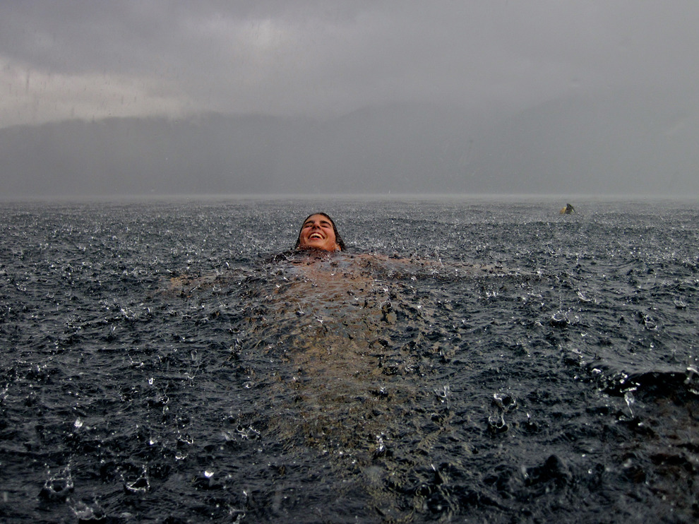 Swimming nude in the rain.