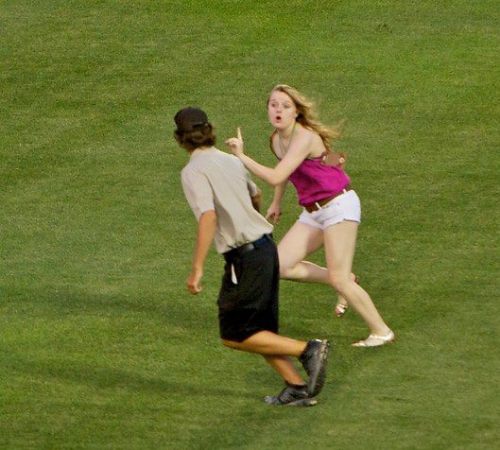 Candice Sortino, age 17, ran out on the field during the 7th inning of the Arizona vs. South Carolin