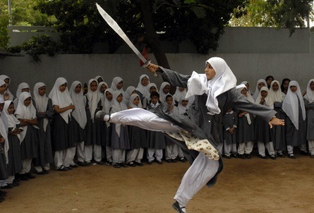 liberated-soul:  Muslim schoolgirls from St. Maaz high school practise Chinese wushu martial arts inside the school compound in the Indian city of Hyderabad. Girls from ages 10 to 16 participate in weekly sessions during school term. Source: 1, 2. 