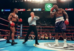 15 YEARS AGO TODAY |6/28/97| Mike Tyson bites Evander Holyfield&rsquo;s ear in the third round of their rematch fight.