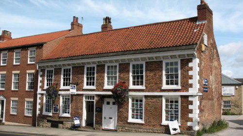 104-106 High Street, Knaresborough - a house built around 1700, now an estate agents office.