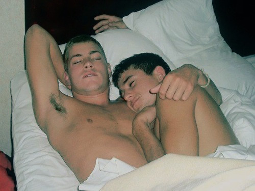 Cute gay guys cuddling