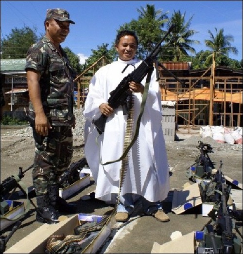  Angels watching our backs…Mindinao Phillipines; Catholic priests bless the weapons of Filipi