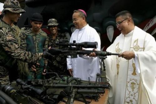  Angels watching our backs…Mindinao Phillipines; Catholic priests bless the weapons of Filipi