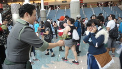 laughingalonewithbrojohn:  lemonorangelime:  This nice Bolin cosplayer went around handing out pink roses to every Korra cosplayer.  Here’s me(Korra) getting one.  What a sweet guy :D  ohmy goooood. this is the best way to cosplay ok.  