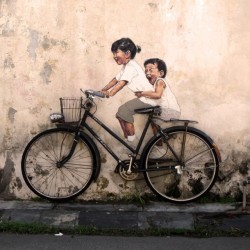 2headedsnake:  thisiscolossal.com Painter Ernest Zacharevic created new works where his painted figures of mischievous children are seen interacting with their physical surroundings. 