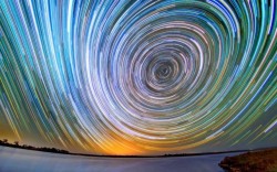 the-star-stuff:  Star trails over the Australian Outback by photographer Lincoln Harrison Photographer Lincoln Harrison spends hours with his camera in the Australian Outback to create these magnificent star trail pictures. The colourful spirals are the