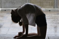 claireruns:  claireruns:  Possibly one of my most favorite photos of me, ever. This was at the giant Buddha, and it was starting to rain so we took shelter underneath this archway. As the photo was being taken, people started to crowd and watch and it