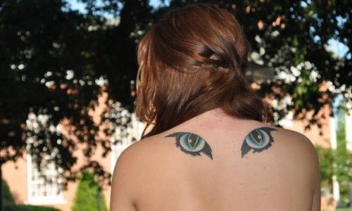 fuckyeahtattoos:  I got this done on my 18th birthday at a place called New Orleans ink by a guy named Patrick. They are simply cat eyes; I love animals and I thought the tat was wicked so I got it :)