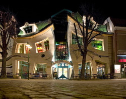 gothiccharmschool:  This is the best shopping center I have ever, ever seen. I want to live there.  archiemcphee:  No need to rub your eyes, clean your screen, or cry photoshop. This awesomely warped building is completely real. Known as Krzywy Domek,