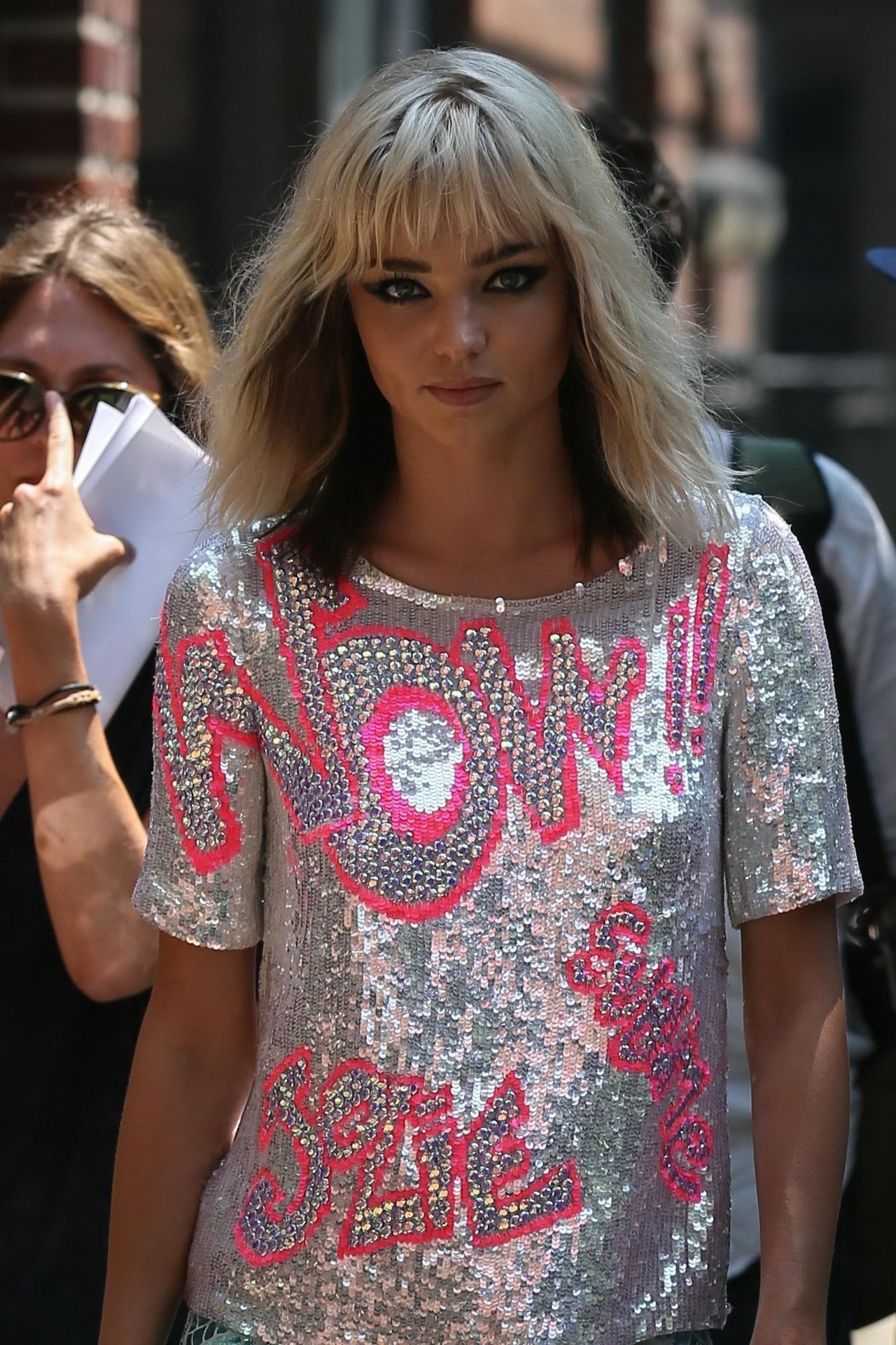 Miranda Kerr. ♥  Looking so cute in a blonde wig, silver top, blue sequined trousers